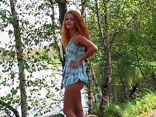 Bold Redhead Model Poses Nude In Forest