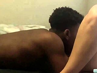 In a steamy interracial encounter a massive black cock plunged deep into her tight pink pussy leading to an explosive cumshot after intense blowjob action