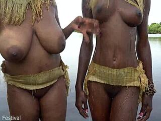 two african zulu women bathing outdoors in village ranch which big tits look better to you