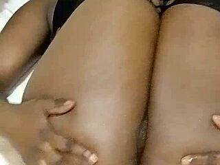 Oiled curvy black slut rubs dildo on juicy wet pussy