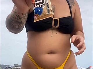 I feel excited wearing tight yellow bikini on beach showing swollen pussy