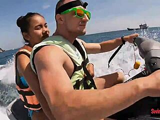 In an adventurous twist the asian girlfriend surprises with a daring public blowjob on a jetski outdoors