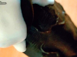 i'm jerking off this big black dildo with gloves on