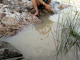 Outdoor fun by the river with a hot Indian couple in doggystyle action