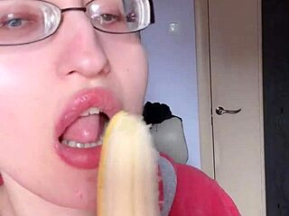 mmm my glossy pink lips devour banana with long nails glasses