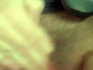 blonde teases her pussy by the window