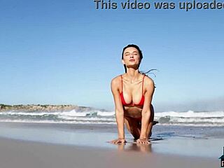 Gorgeous Brunette Gloria Sol Strips on Beach